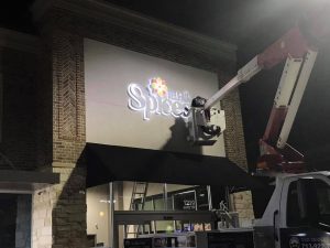 Geneva Neon Signs illuminated cabinet channel letters outdoor install 300x225